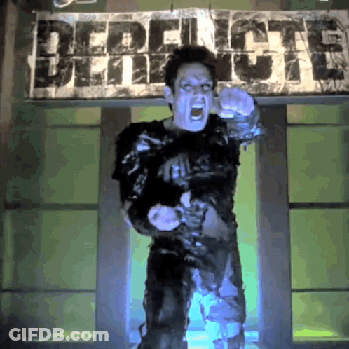A Man Is Screaming In Front Of A Sign That Says Demolition GIF