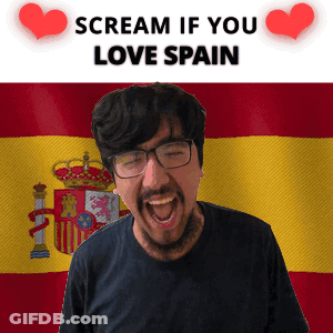 A Man Is Screaming In Front Of A Spanish Flag GIF