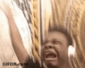 A Man Is Screaming While Wearing Headphones And Holding A Sword In His Hand . GIF