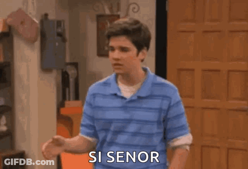 A Man Is Screaming With His Arms In The Air And The Words `` Si Senor '' Written On The Screen . GIF
