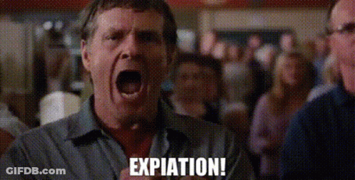 A Man Is Screaming With His Mouth Open In Front Of A Crowd And The Word Expiration Is Written On The Screen . GIF