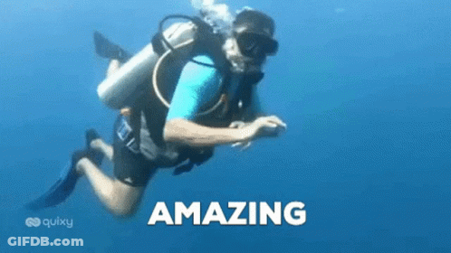 A Man Is Scuba Diving In The Ocean And The Word Amazing Is On The Bottom Of The Picture . GIF