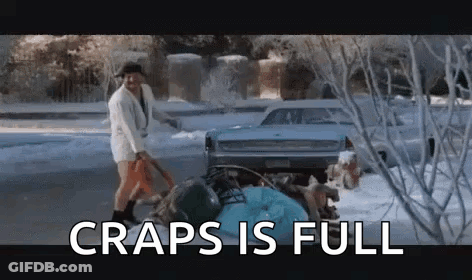 A Man Is Shoveling Snow In Front Of A Car In The Snow With The Words `` Craps Is Full '' . GIF