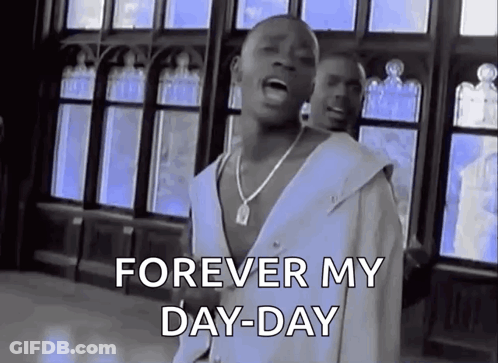 A Man Is Singing A Song In Front Of A Window While Wearing A White Shirt And A Necklace . GIF