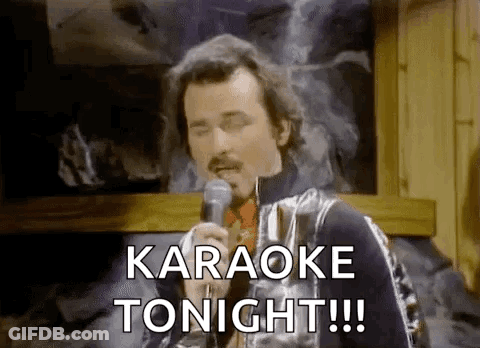 A Man Is Singing Into A Microphone And Saying `` Karaoke Tonight !!! '' . GIF