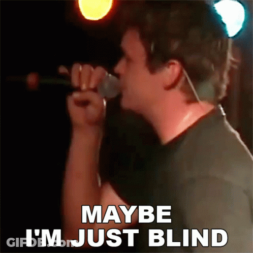 A Man Is Singing Into A Microphone And Says Maybe I 'M Just Blind GIF