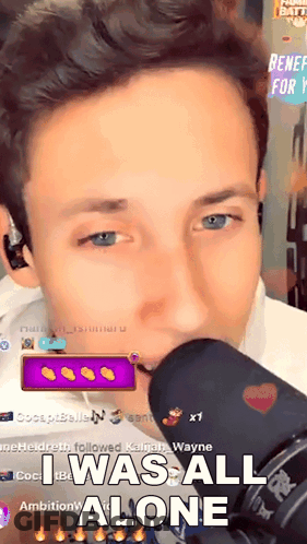 A Man Is Singing Into A Microphone And The Caption Says I Was All Alone GIF