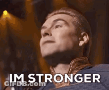 A Man Is Singing Into A Microphone With His Eyes Closed And The Words `` Im Better '' Written On His Face . GIF
