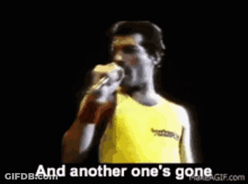 A Man Is Singing Into A Microphone With The Words And Another One 'S Gone Behind Him . GIF