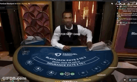 A Man Is Sitting At A Blackjack Table With A Wait For Next Game Message GIF