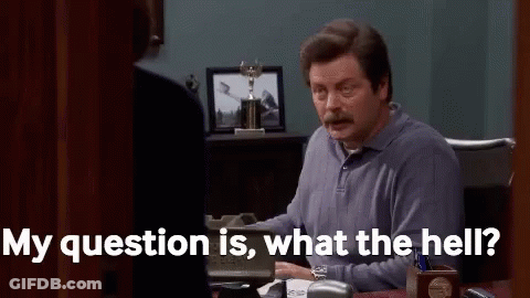 A Man Is Sitting At A Desk In An Office Talking To A Woman And Saying `` My Question Is , What The Hell ? '' GIF