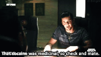 A Man Is Sitting At A Table And Says " That Cocaine Was Medicine " GIF