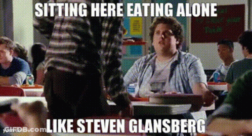 A Man Is Sitting At A Table Eating Alone With A Caption That Says Sitting Here Eating Alone Like Steven Glasberg GIF