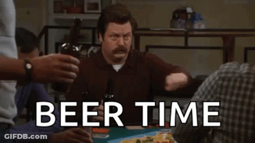 Man Sitting At Table Holding Beer Bottle GIF