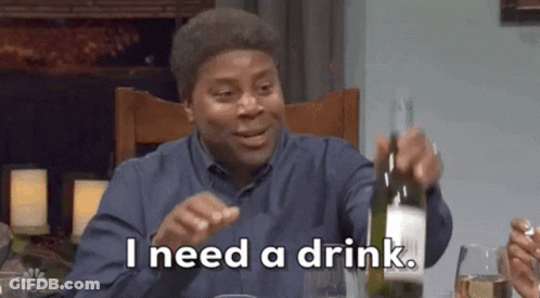Man Sitting At Table Holding Wine Bottle GIF