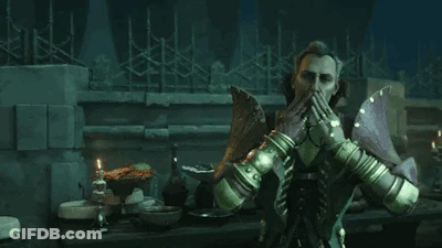 A Man Is Sitting At A Table In A Dark Room Holding A Sword . GIF