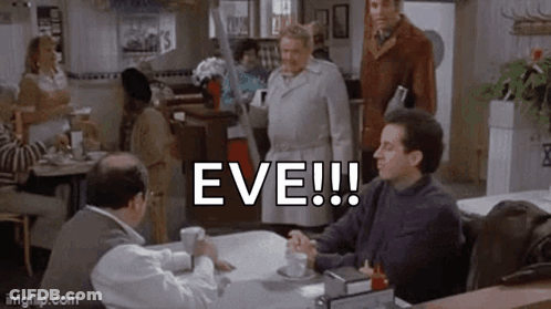 A Man Is Sitting At A Table In A Restaurant Talking To A Woman . GIF