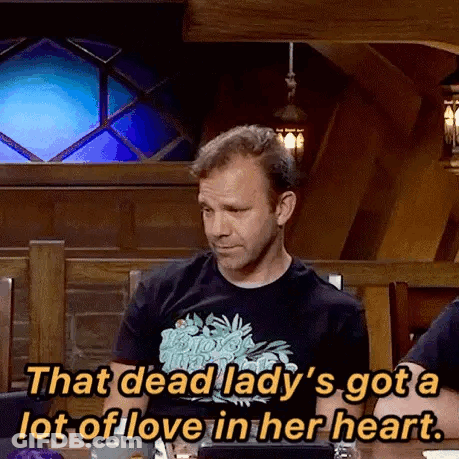 A Man Is Sitting At A Table Talking About A Dead Lady 'S Got A Lot Of Love In Her Heart GIF