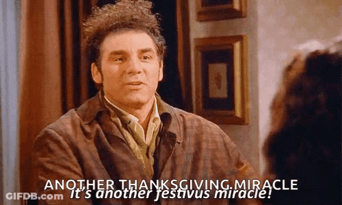 A Man Is Sitting At A Table Talking To A Woman And Saying Another Thanksgiving Miracle GIF