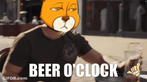 Man Sitting At Table With Beer O'Clock Sign GIF