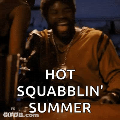 A Man Is Sitting At A Table With A Glass Of Beer In His Hand And Says Hot Squabblin ' Summer . GIF
