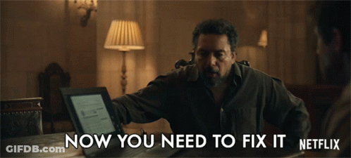 A Man Is Sitting At A Table With A Laptop And The Words Now You Need To Fix It Netflix GIF