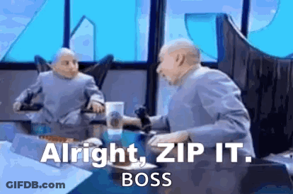 A Man Is Sitting At A Table With A Microphone In His Hand And Says `` Alright , Zip It . Boss '' . GIF