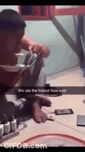 A Man Is Sitting At A Table With A Phone And A Bowl Of Food With The Caption Bro Ate The Hottest Food Ever GIF