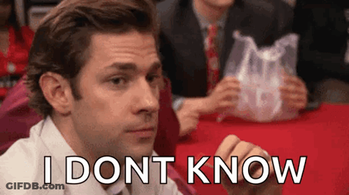 A Man Is Sitting At A Table With A Plastic Bag In His Hand And The Words `` I Don T Know '' Written On His Face GIF