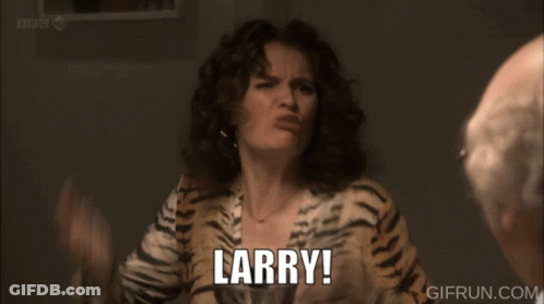 A Man Is Sitting At A Table With A Plate Of Food And A Glass Of Wine While A Woman Says What GIF