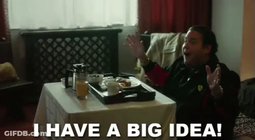 A Man Is Sitting At A Table With A Tray Of Food And The Words I Have A Big Idea GIF