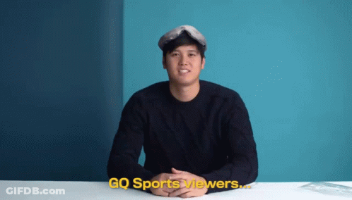 A Man Is Sitting At A Table With Gq Sports Viewers Written On The Bottom GIF