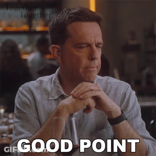 A Man Is Sitting At A Table With His Eyes Closed And The Words Good Point Written On His Face GIF