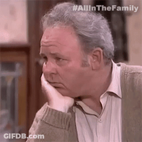 Man Sitting With Hand On Face GIF