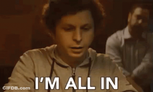 A Man Is Sitting At A Table With His Mouth Open And Says `` I 'M All In '' . GIF