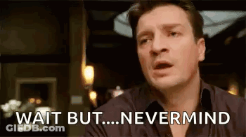 A Man Is Sitting At A Table With His Mouth Open And Says `` Wait But ... Nevermind '' . GIF