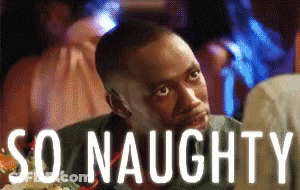 A Man Is Sitting At A Table With The Words So Naughty Written Above Him GIF