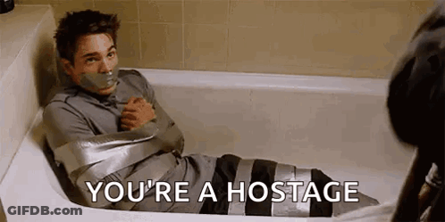 A Man Is Sitting In A Bathtub Wrapped In Duct Tape And Says `` You 'Re A Hostage '' . GIF