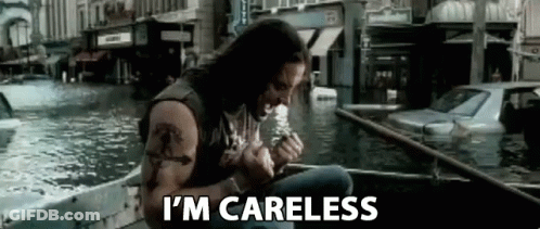 A Man Is Sitting In A Boat In The Water Smoking A Cigarette . GIF
