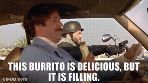 A Man Is Sitting In A Car Eating A Burrito While Another Man Rides A Motorcycle . GIF