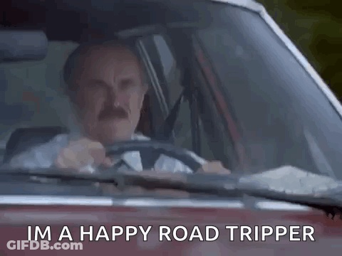 A Man Is Sitting In A Car Giving The Middle Finger . GIF