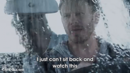 A Man Is Sitting In A Car Looking Out The Window And Says I Just Can 'T Sit Back And Watch This . GIF