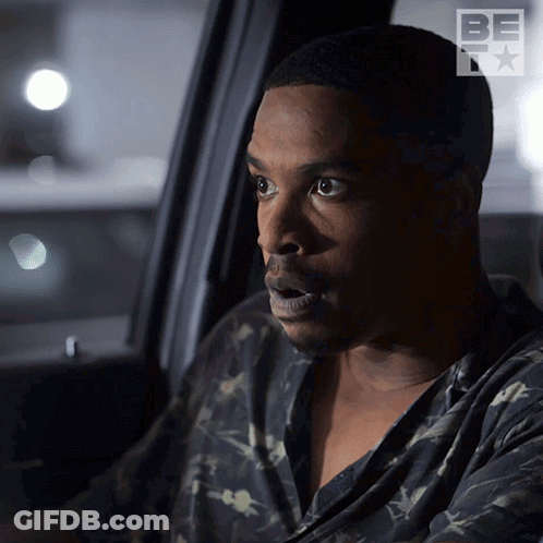 A Man Is Sitting In A Car With A Be Tv Logo On The Side GIF