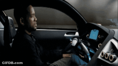 A Man Is Sitting In A Car With A Dashboard That Says 000 GIF
