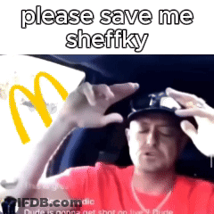 A Man Is Sitting In A Car With A Mcdonald 'S Logo In The Background GIF