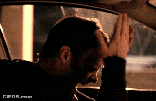 Man Sitting In Car With Hand On Head GIF