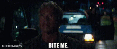 A Man Is Sitting In A Car With The Words `` Bite Me '' Written On The Screen . GIF