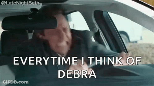 A Man Is Sitting In A Car With The Words Everytime I Think Of Debra GIF