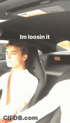 A Man Is Sitting In A Car With The Words Im Loosin It Written Above Him GIF