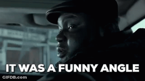A Man Is Sitting In A Car With The Words `` It Was A Funny Angle '' Written On The Screen . GIF